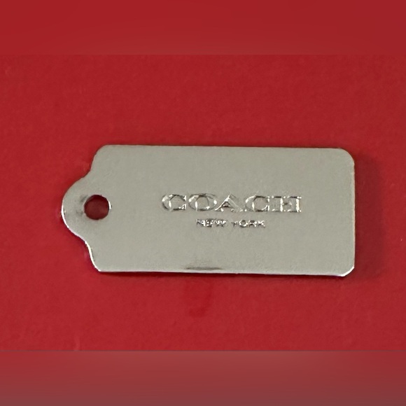 Coach Handbags - Coach Metallic Silver Bag Tag